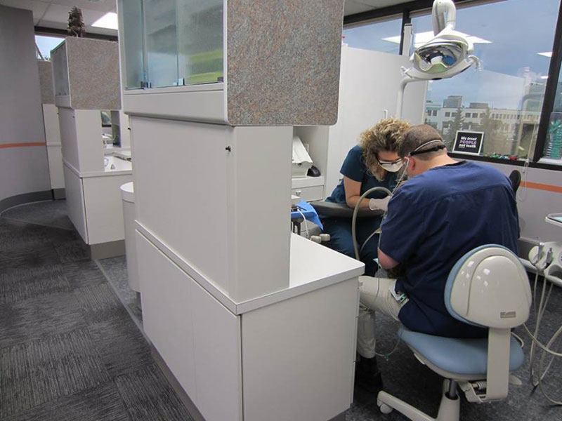Kennedy Dental Group dental team working on a a patient